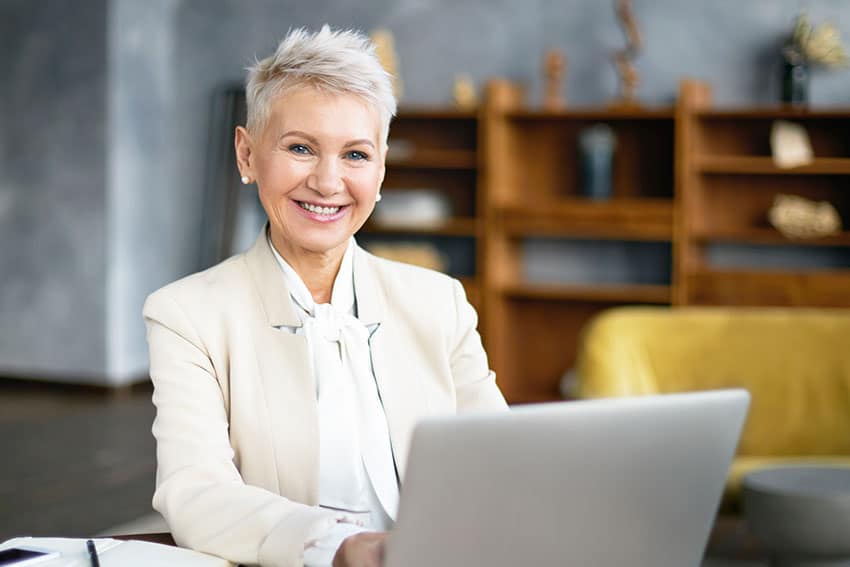 mature woman working on her laptop