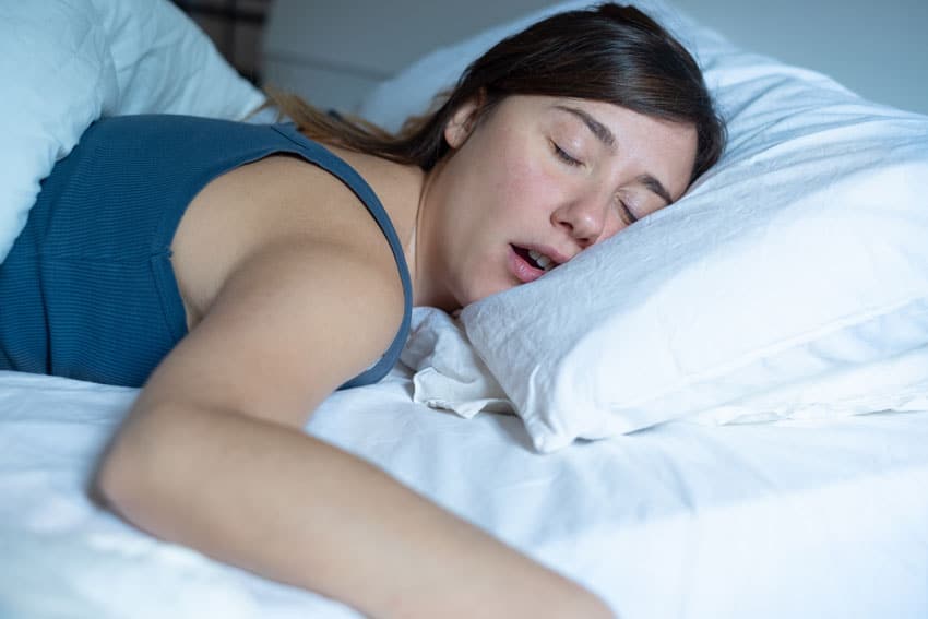 woman sleeping on stomach and snoring